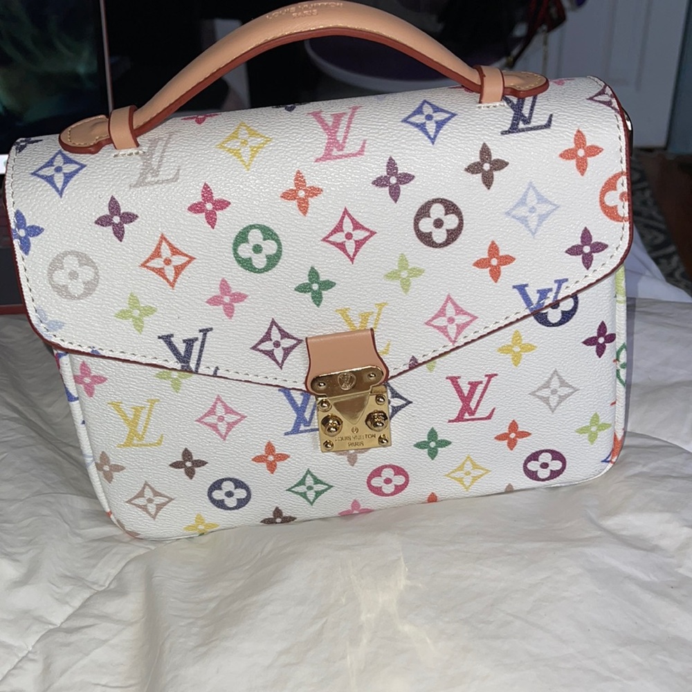 LOUIS VUITTON CROSSBODY ( has scoff on the back as shown in pic)